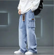 Light blue cargo pants worn by a person on a gray background