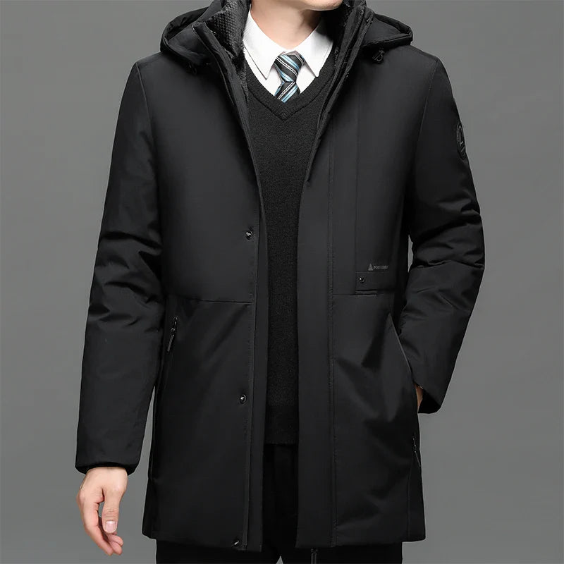 Black coat worn by a person on a gray background