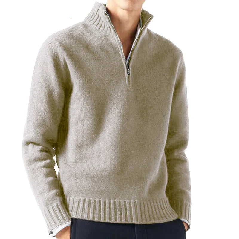Beige half-zip sweater worn by a person on a white background with 'Animal Game' branding.
