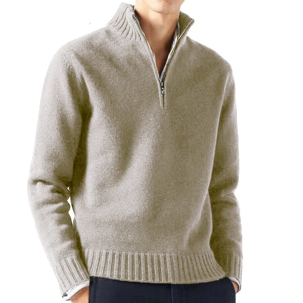 Beige half-zip sweater worn by a person on a white background with 'Animal Game' branding.