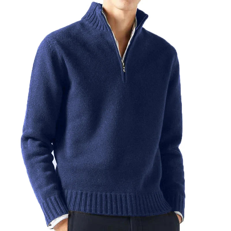 Navy blue half-zip sweater worn by a person on a white background