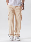 Person wearing beige cargo pants on a white background