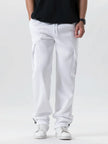 Person wearing white cargo pants and black shirt on a white background