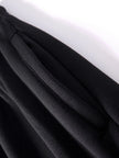 Close-up of black fabric with a white background