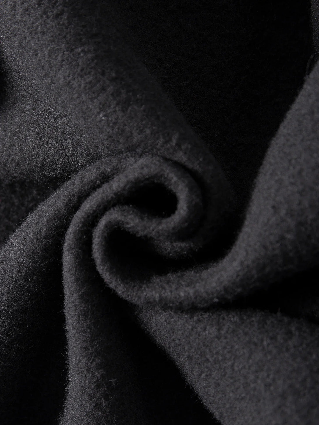 Close-up of dark gray fabric with a textured surface