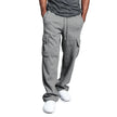 Person wearing gray cargo sweatpants on a white background