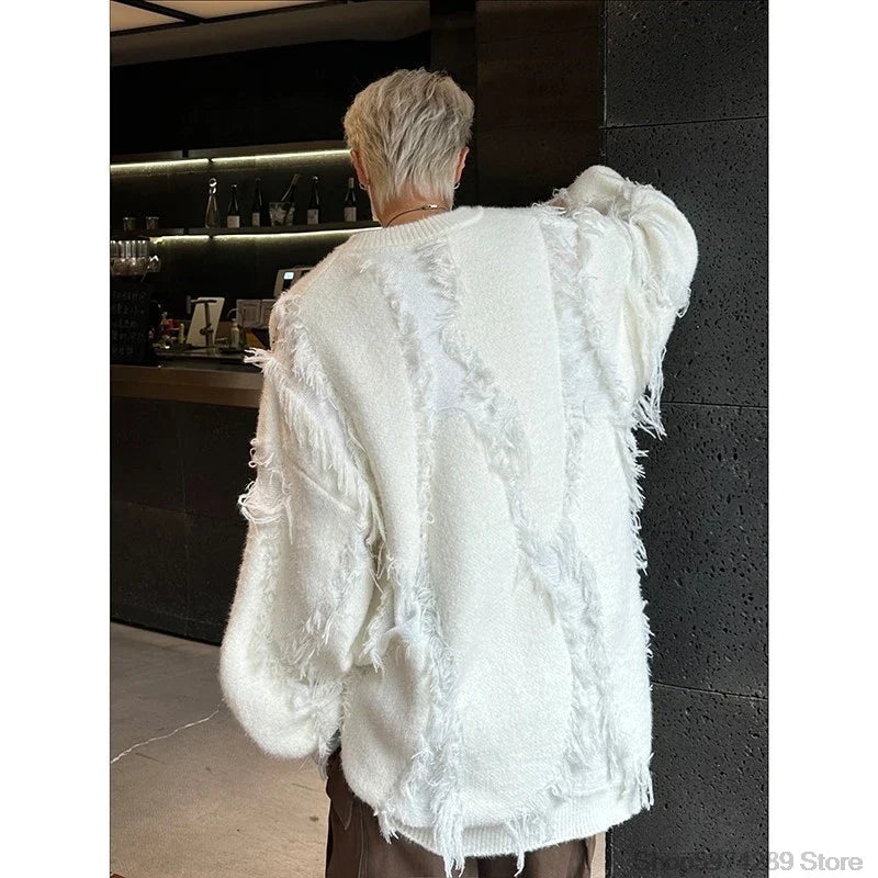 Person wearing a white textured jacket in an indoor setting
