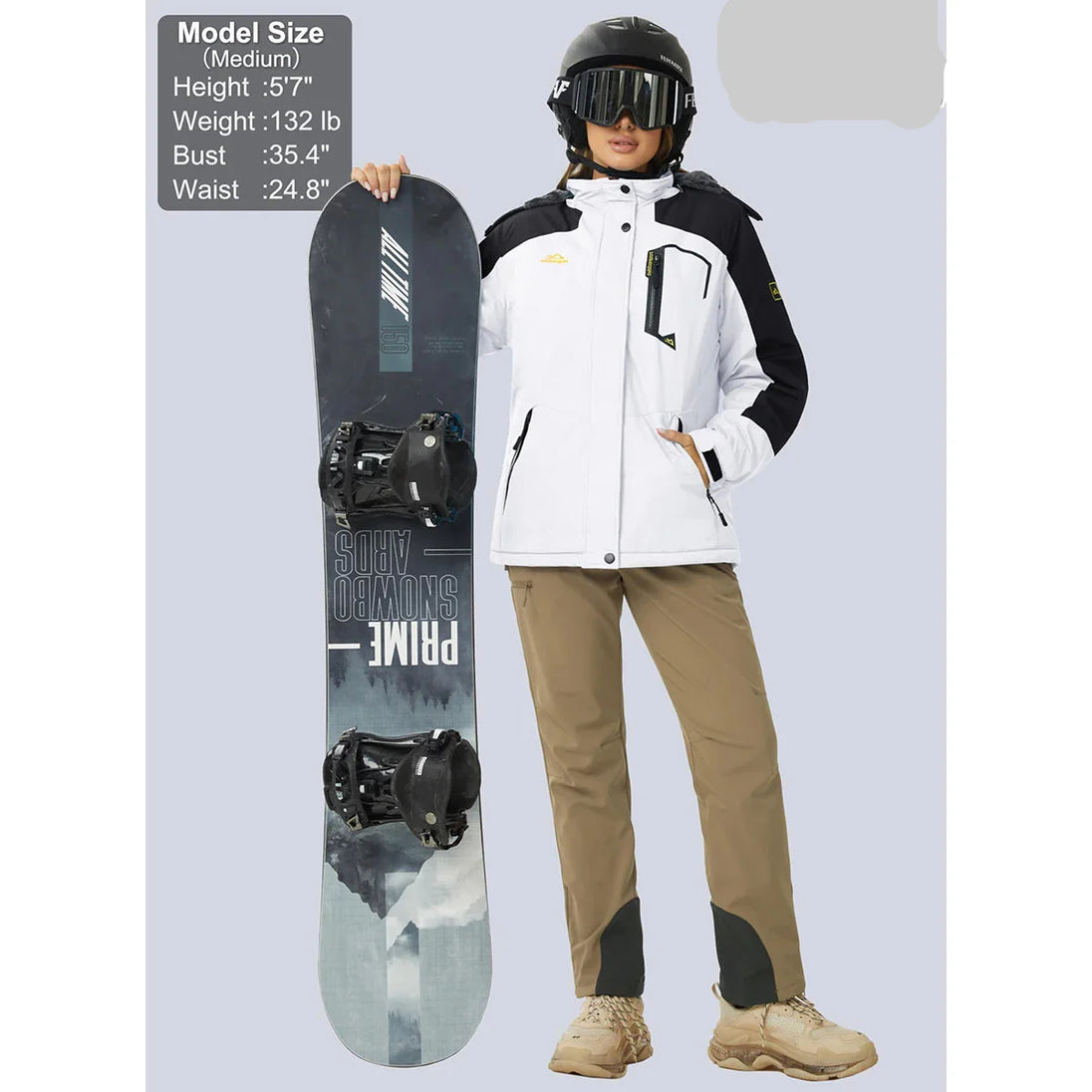 Person holding a snowboard with Magcomsen branding on a light gray background